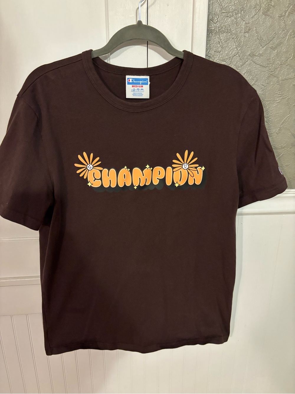 Champion Brown Graphic Tee with Orange Floral Logo
